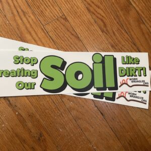 Pile of Bumper Stickers that say "stop treating our soil like dirt"